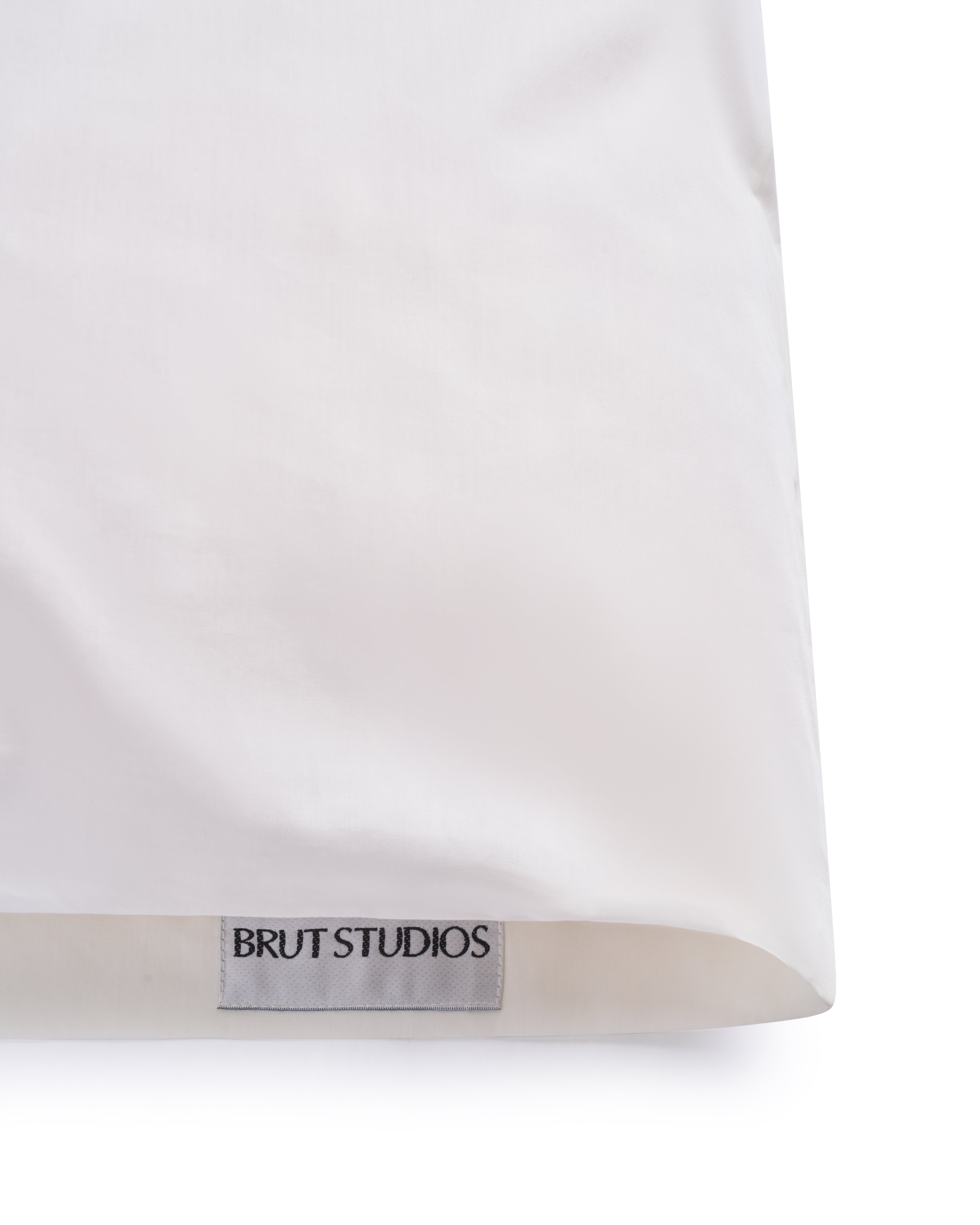 Ashen Stone percale pillowcase, styled on pillow