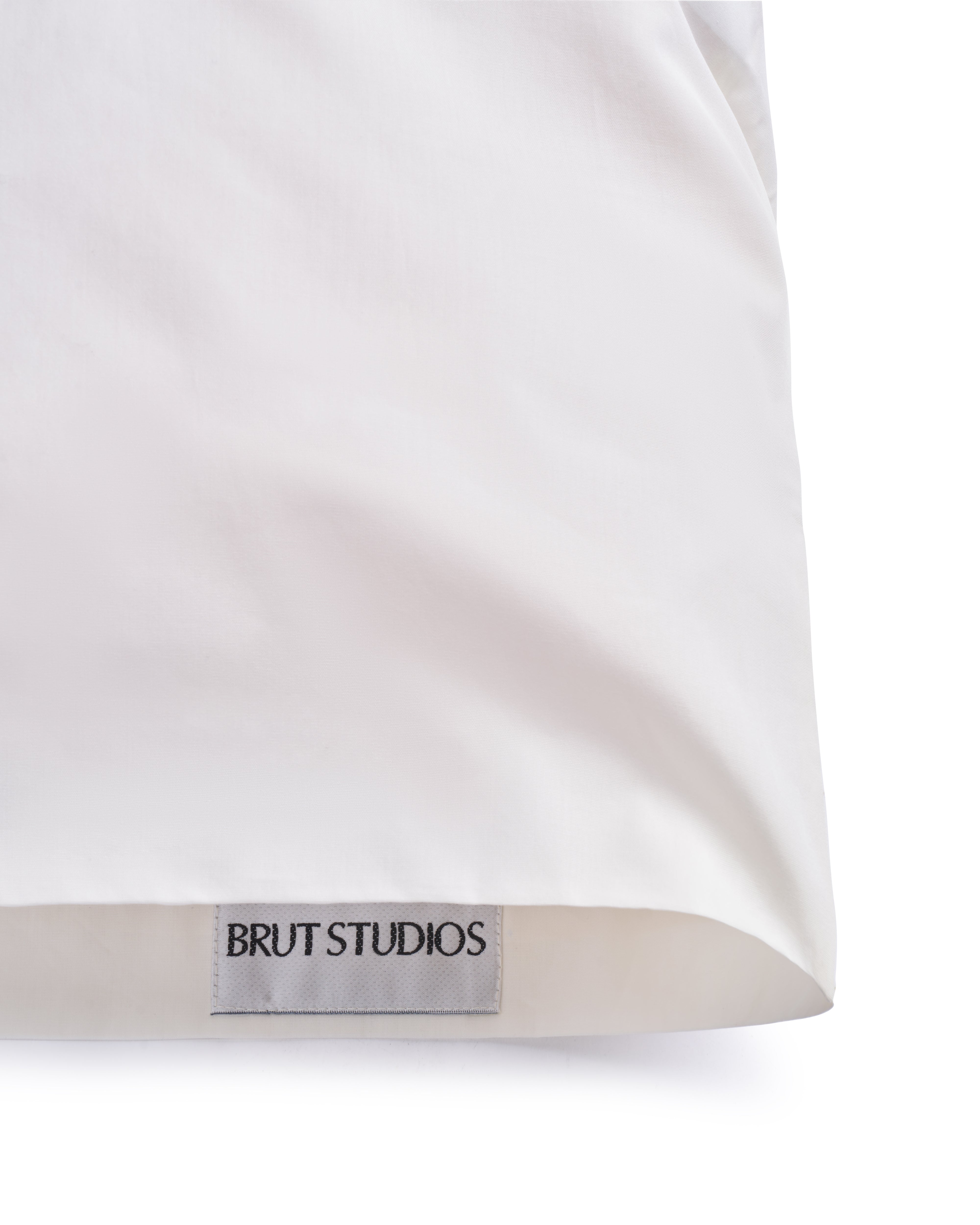 Ashen Stone sateen pillowcase, styled on pillow